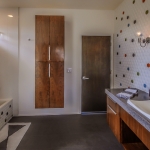 Another secondary bath w 3D tiles on the walls and quartz countertops.