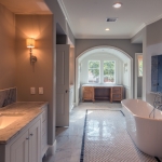 Master Bath w his and her vanity. Also a separate make up vanity. Huge walk in shower