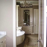 Master Suite view of breakfast bar with refrigerator and master bathroom.