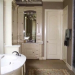 Master Bathroom - Approx 16 x 10 . Limestone floor, walk-in marble surround shower,BainUltra spa bath, 2 custom built-in vanity sinks with marble countertops, 2 walk-in closets, custom lighting. Arched window with extra sound proof 