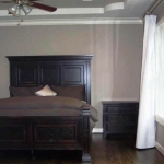 Master Bedroom - Approx 19 x 15 . Windows overlook backyard, hardwood floor, crown molding, coffered ceiling, extra sound proof windows and sound buffering curtain. 