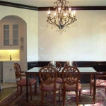 Dining Room - Approx 12 x 16. Arched entryways and window Hardwood floor Stained wainscoting Crown molding Schoenbeck chandelier 