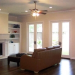 Family Room - Approx 23 x 17. Stone faced fireplace, hardwood floor, custom built-ins, French doors to covered patio,recessed lighting, crown molding. 