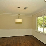 Dining Room set apart with chair rail. All wiring and light fixtures were replaced.