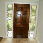 Entry door with Vintage Side Lights original to the house.