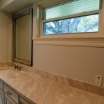 Hall bath, outfitted as elegantly as the master bath, tub/shower and water closet in separate area.