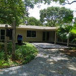 Back of home, attached three-car garage.