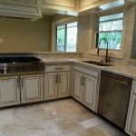 Commercial Professional Six-Burner Gas Cook op. White marble counter tops.